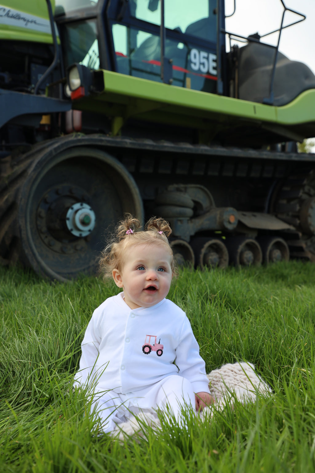 Pink tractor sleepsuit