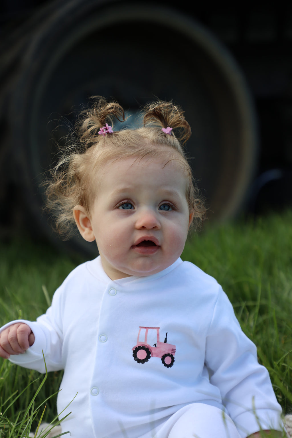Pink tractor sleepsuit